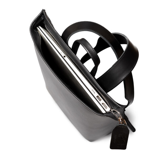 Minimalist black leather backpack ARCH EDGE BACKPACK BLACK with a structured silhouette and adjustable straps.