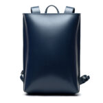 Minimalist navy leather backpack ARCH EDGE BACKPACK NAVY with a structured silhouette and adjustable straps.