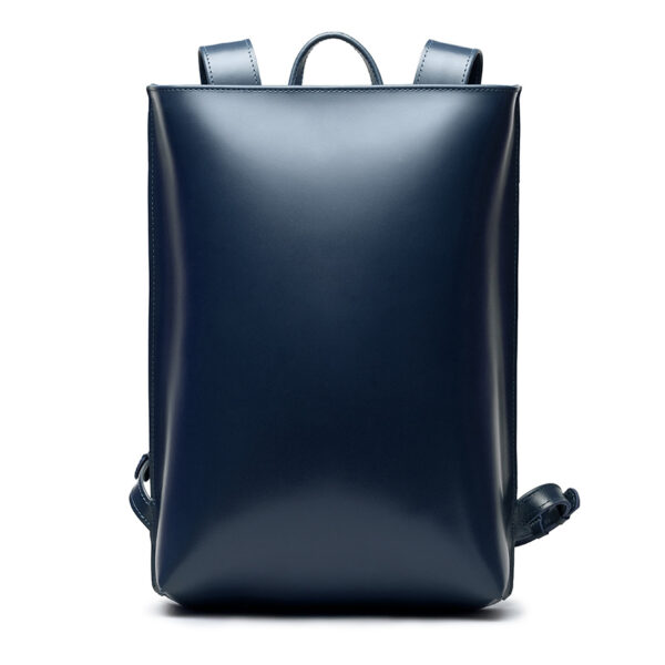 Minimalist navy leather backpack ARCH EDGE BACKPACK NAVY with a structured silhouette and adjustable straps.