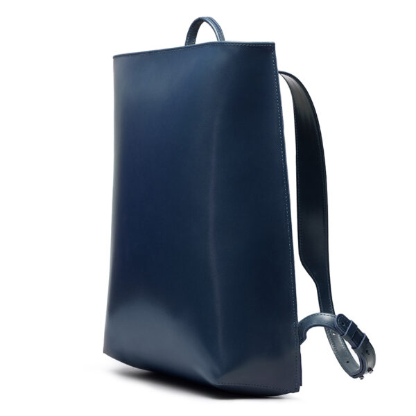Minimalist navy leather backpack ARCH EDGE BACKPACK NAVY with a structured silhouette and adjustable straps.