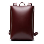 Minimalist bordeaux leather backpack ARCH EDGE BACKPACK BORDEAUX with a structured silhouette and adjustable straps.