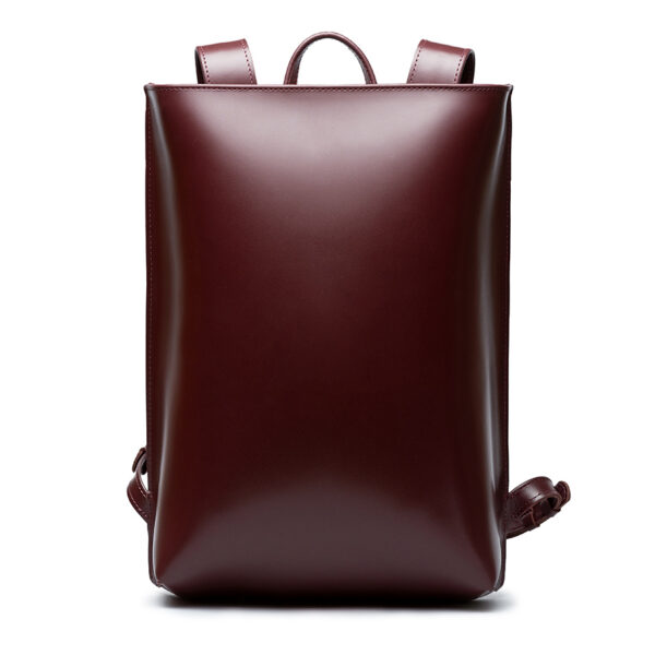 Minimalist bordeaux leather backpack ARCH EDGE BACKPACK BORDEAUX with a structured silhouette and adjustable straps.